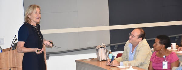 Dr. Kelsey Martin speaking to Dr. Deborah Deas